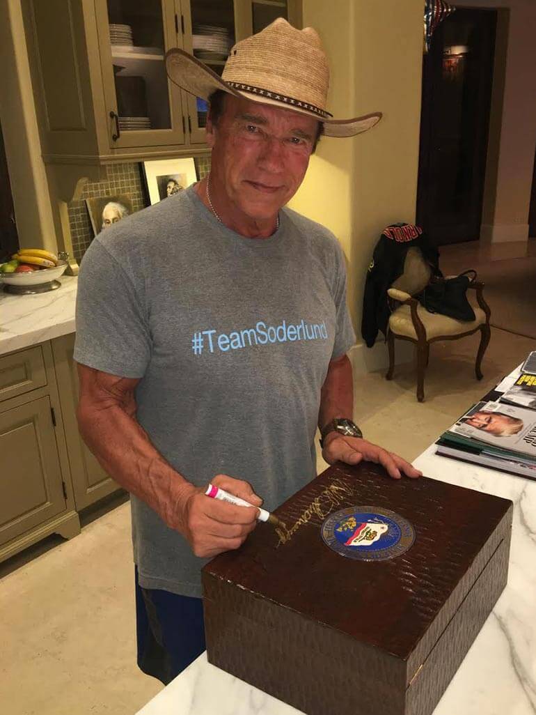arnold-schwarzenegger-signing-daniel-marshall-humidor