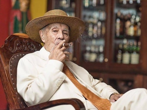 avo uvezian rocking chair smoking cigar