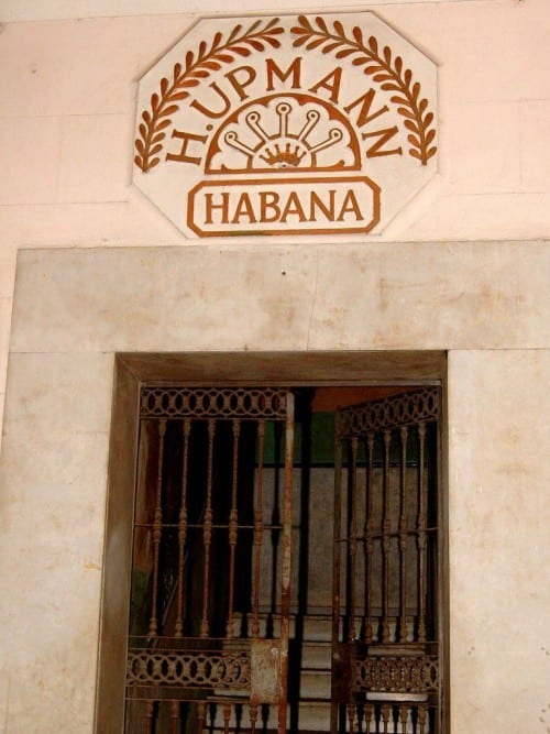 h upmann factory logo above entrance indoor